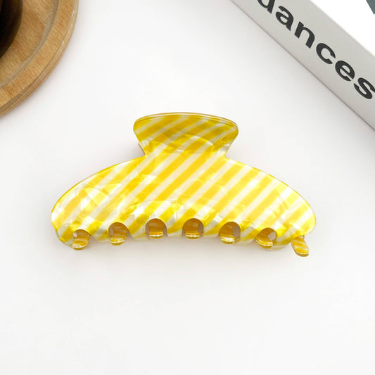 Pince à cheveux ovale rayée Jaune