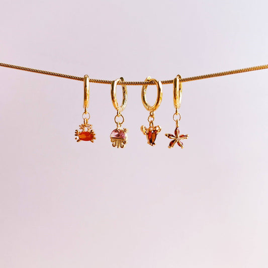 Boucle d’oreille étoile de mer brillante: Rouge / Doré - DupontDupont